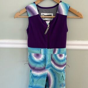 Girls Spyder bib Snowpants in teal, purple and white swirl design